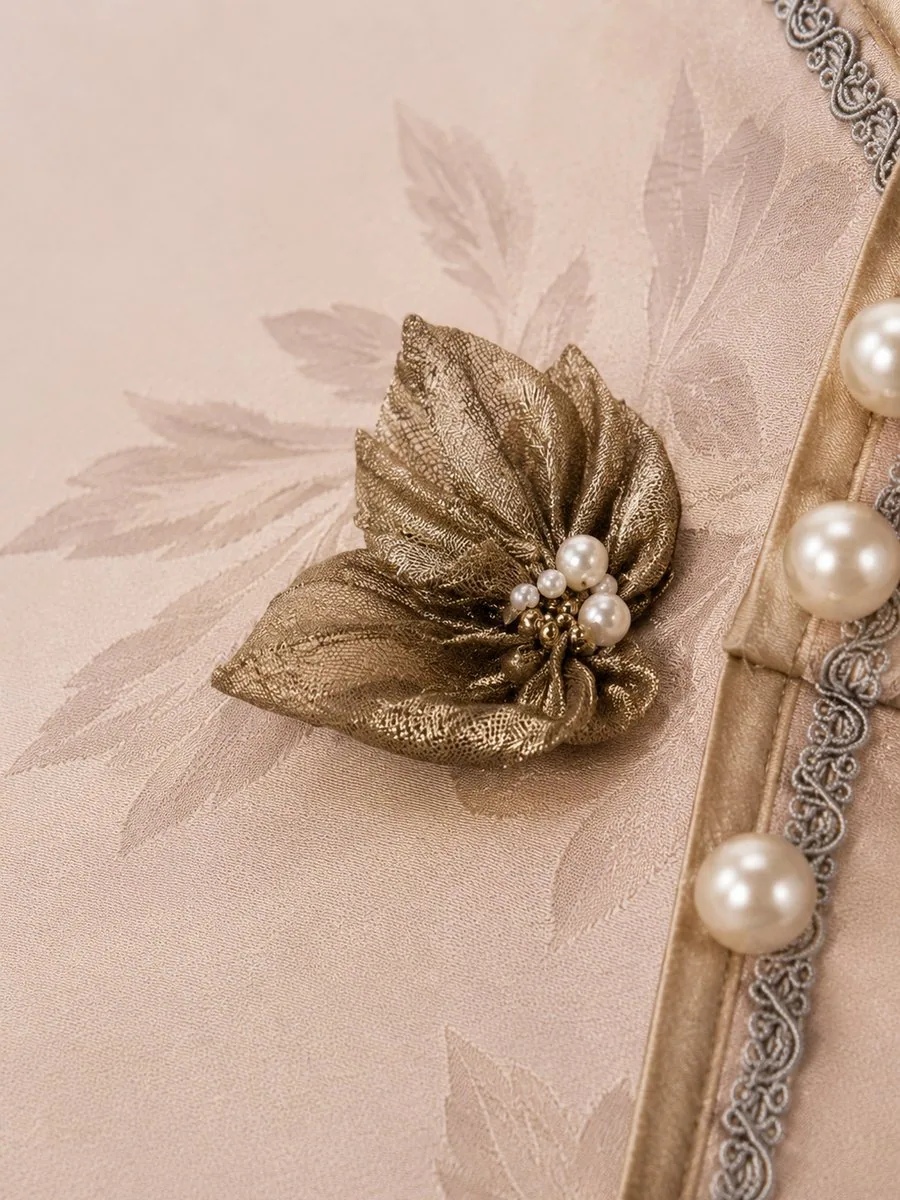 Hand-made silk flower and pearl detail in the atelier
